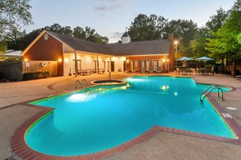 Sparkling swimming pool with chaise lounges